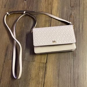 Michael Kors soft pink with gold accents card/phone crossbody bag.